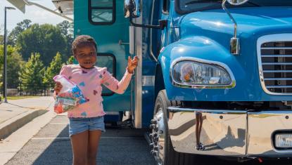 “Children visiting the Forsyth County Bookmobile during the Community Resource Fair.”