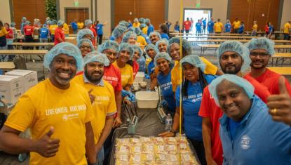 Volunteers packing meals during Day of Caring at the Forsyth Conference Center.